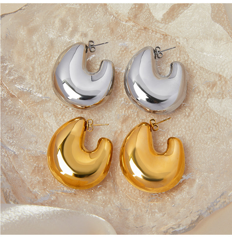 European and American fashion gold geometric C- shaped earrings titanium steel plated 18K gold simple design hollow bright three-dimensional earrings